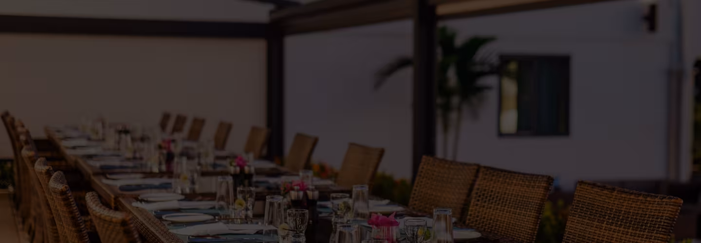 Outdoor dining terrace at Drop Anchor Grill set for dinner